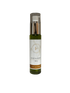 green oil solution in bottle standing in white background 